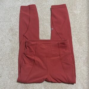 Salmon colored Lululemon high waisted leggings